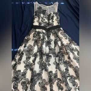 White dress with black flower detail